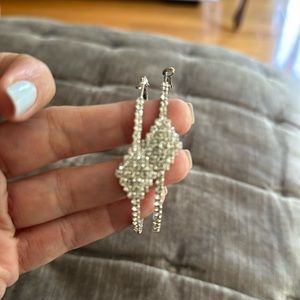 Hoop earrings with rhinestone and a diamond shape detail.